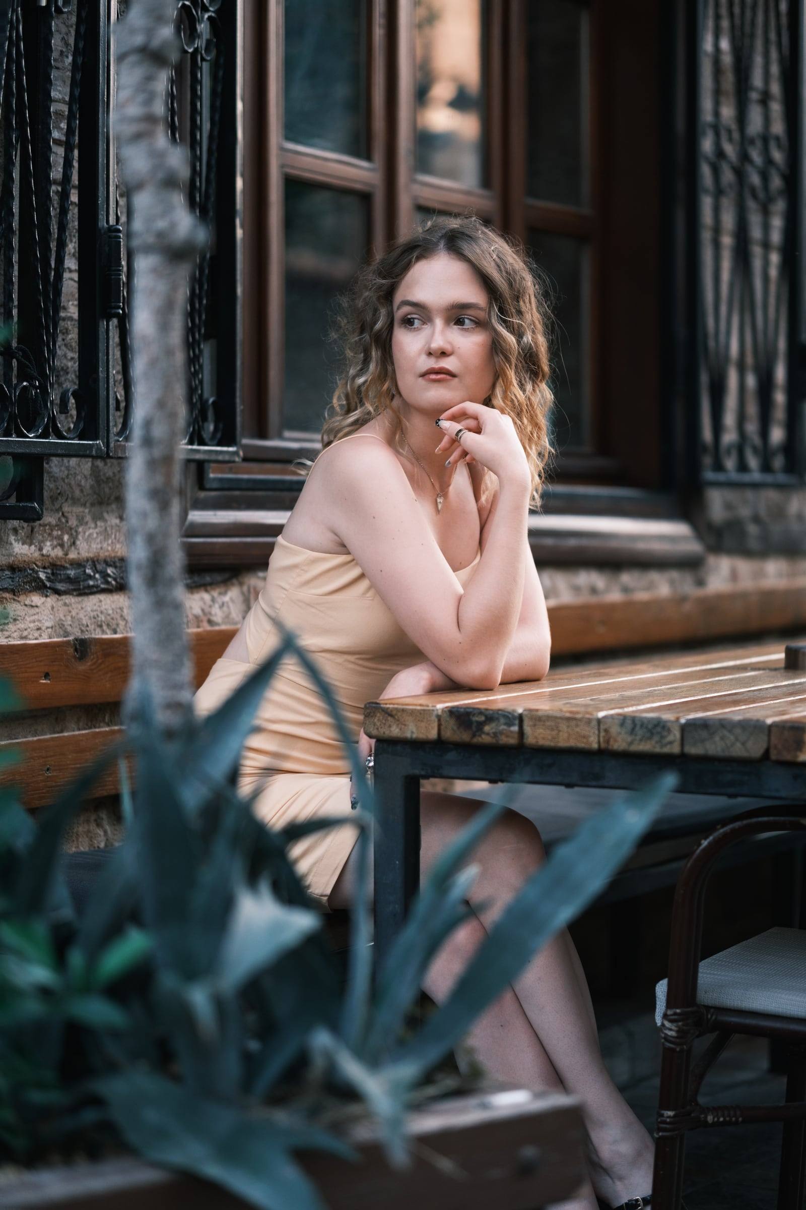 Woman at a café table in the old town