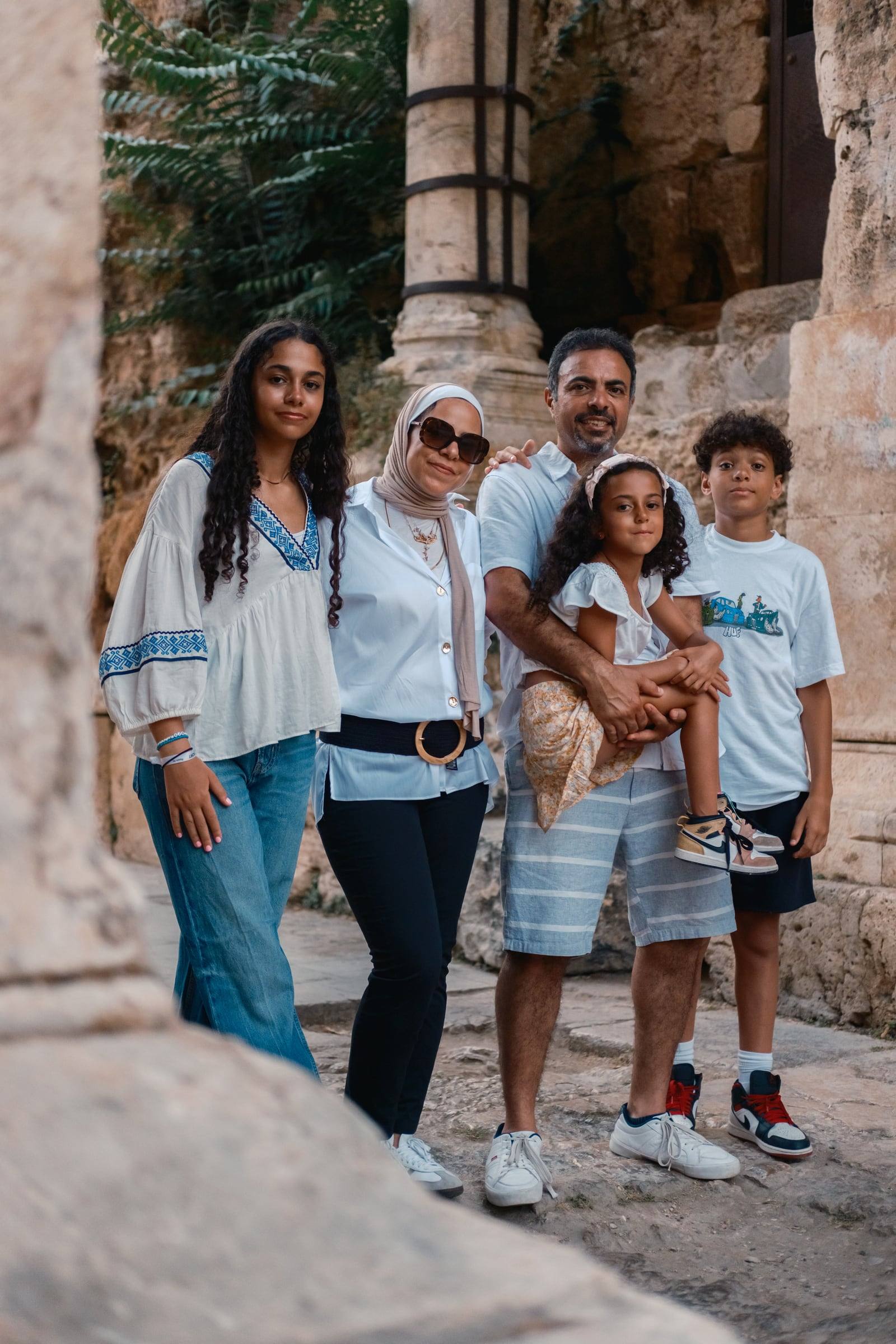 Family of five standing together at Hadrian's Gate